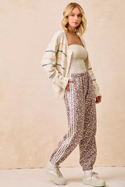 BIBI Side Lines Leopard Track Pants on Simply Obsessed