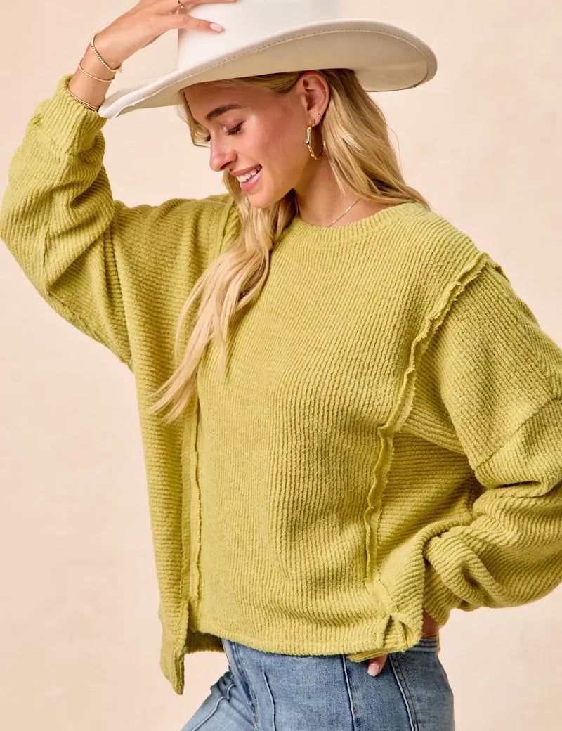 BIBI Boucle Rib Knit Uneven Hem Sweater With Open Seam on Simply Obsessed