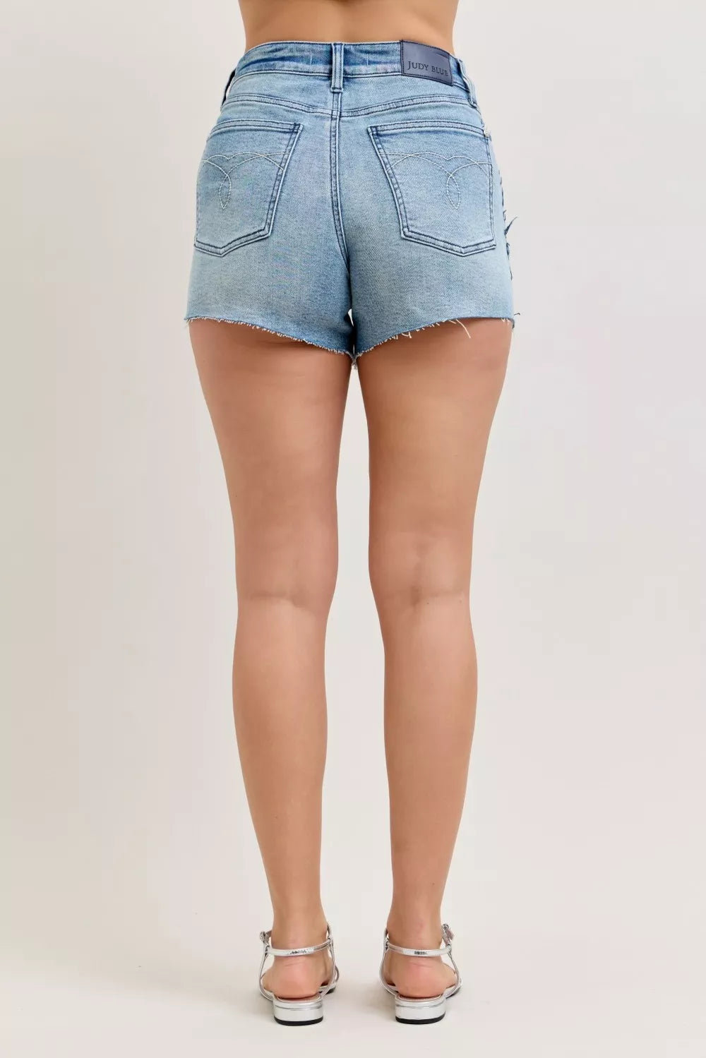 JUDY BLUE Hw Rigid Magic Cut Off Denim Shorts with Raw Side Seams on Simply Obsessed