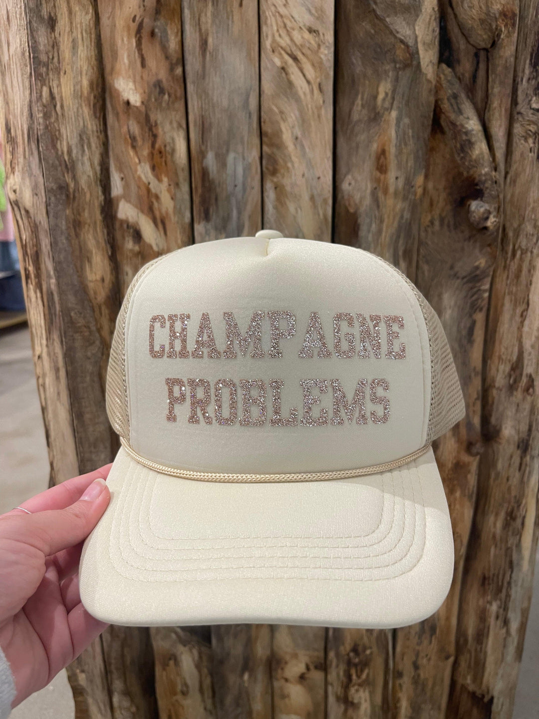 Champagne Problems Trucker Hat on Simply Obsessed