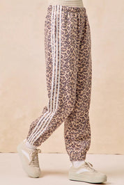 BIBI Side Lines Leopard Track Pants on Simply Obsessed