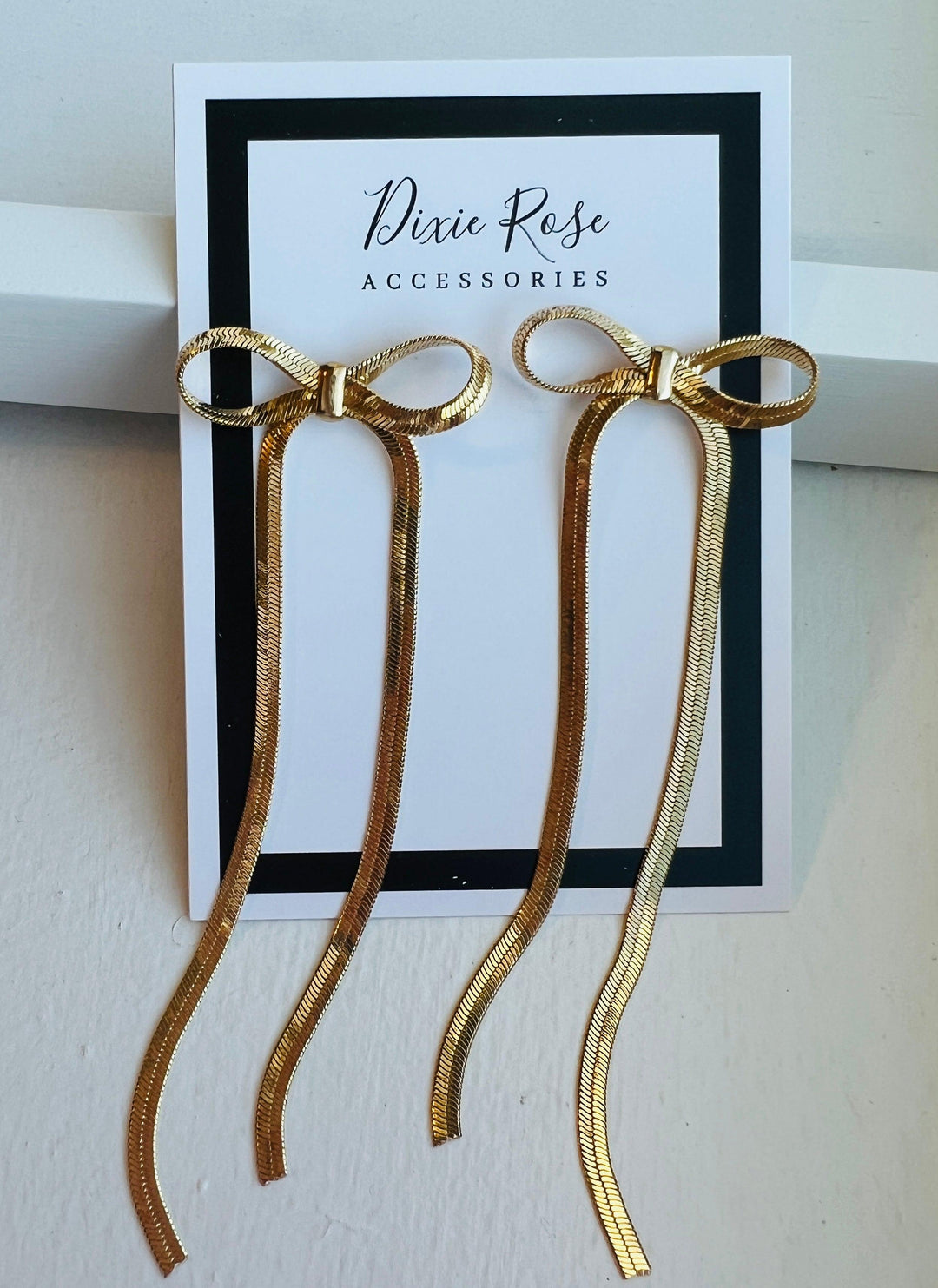 DIXIE ROSE Gold Snake Chain Bow Earrings on Simply Obsessed