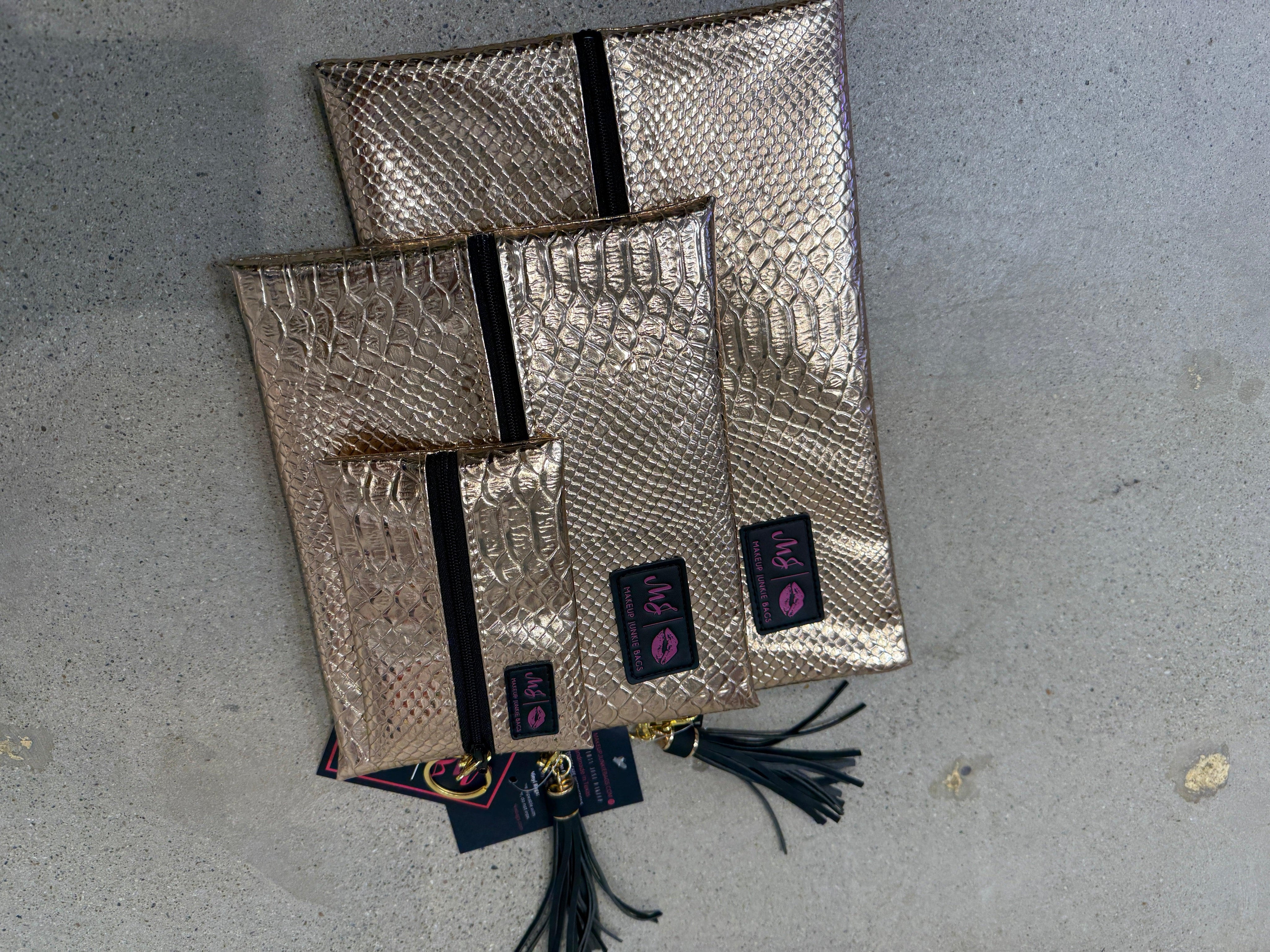 MAKEUP JUNKIE Metallic Gold Bags on Simply Obsessed