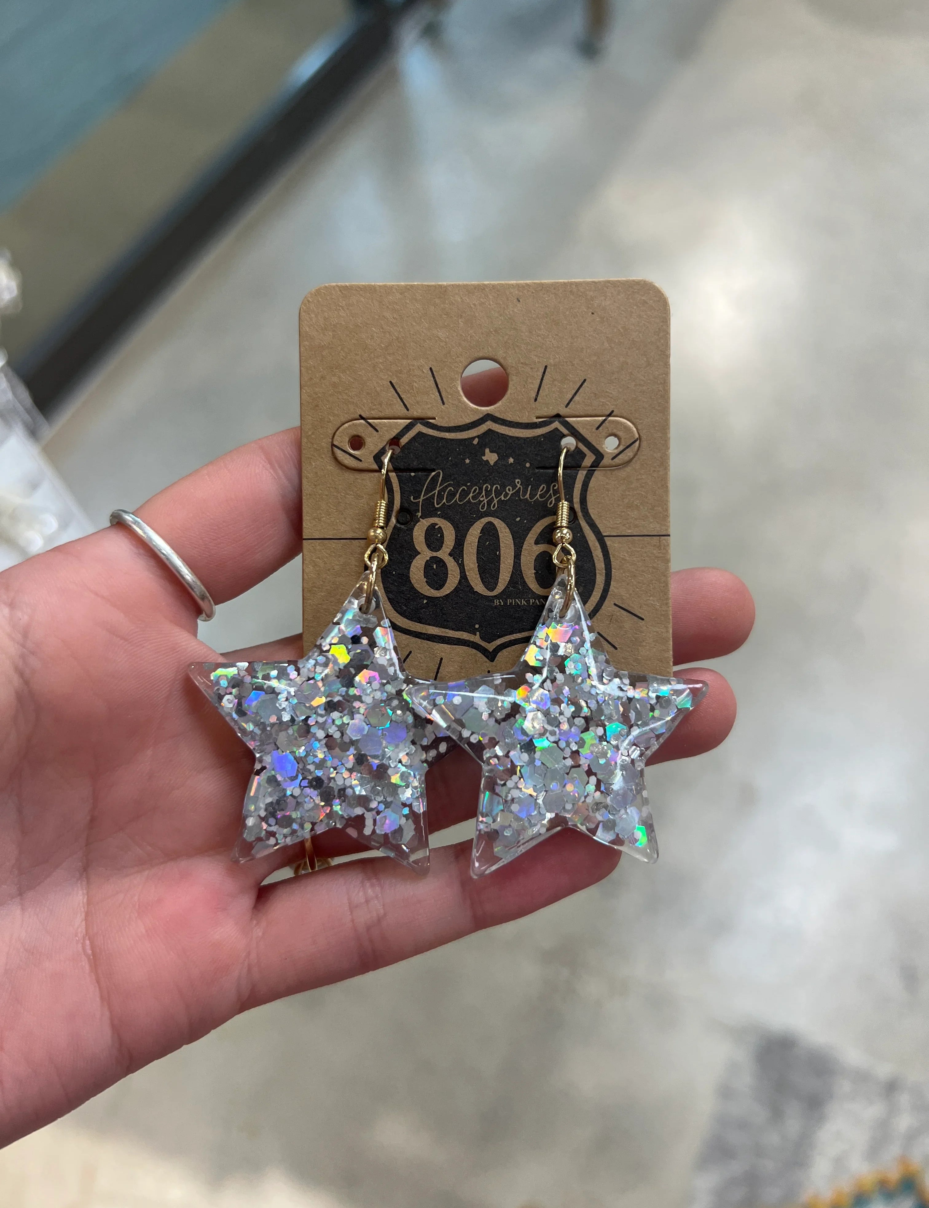 PINK PANACHE Silver Glitter Star Earrings on Simply Obsessed