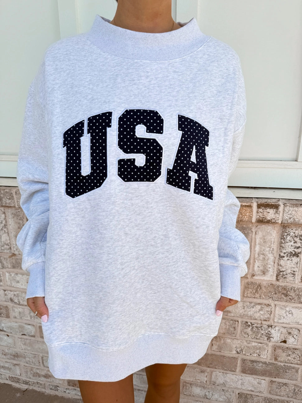 SUNKISSED COCONUT Pearl Grey Navy Blue Polka Dot USA Mockneck Sweatshirt on Simply Obsessed